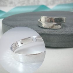 photo shows a silver wrap style ring