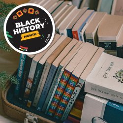 A plie of books in various shapes, sizes and colours with a black sticker saying "Black History Month"