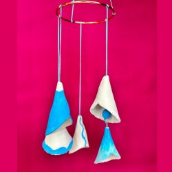Mobile of bell shapes made from air drying clay and painted blue and white