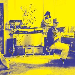 two guys in a room listening to music. A reportage 90's snapshot into dance music culture.