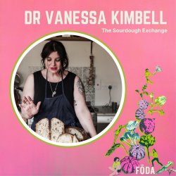 photo of Dr Vanessa Kimbell wearing an apron with her right hand up, with loaves of sourdough in front of her