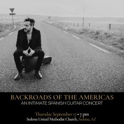 Black-and-white promotional image of Spanish guitarist Diego García seated on his guitar case in the middle of an empty rural road.