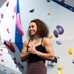 Smiling climber in an indoor climbing centre