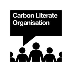 Carbon Literate Organisation Logo with black speech bubble and silhouettes of people icons.