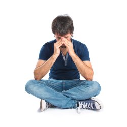 Man sitting cross legged looking sad, Designed by Freepik