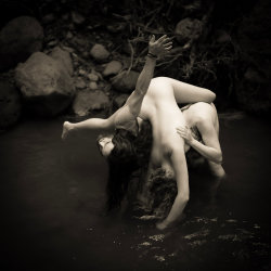 three dancers in the river
