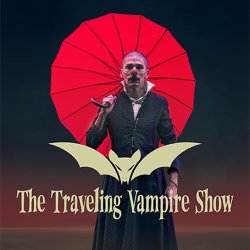 Promotional graphic for The Traveling Vampire Show, featuring a man with a shaved head and red clown nose in a long black coat holding a red umbrella against a dark background with a bat logo.