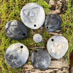 Pit-fired amulets