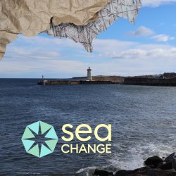 Coastal scene with a lighthouse on a pier under a blue sky. Waves crash against rocks. "Sea Change" logo overlays the image.