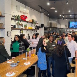 People mingling before the start of Pasta Party