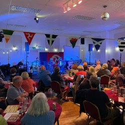 A hall full of people singing