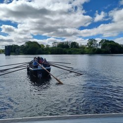 Rowers out on a Sunny Day on the Lake