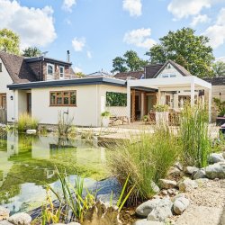 Retreat house with outside patio, swimming pond and plants