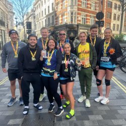 Fight for Sight supporters proudly displaying their medals after completing the London Landmarks Half Marathon
