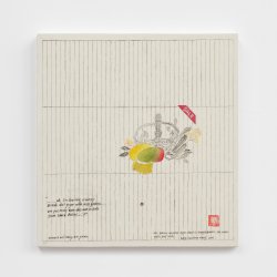 A square, white painting with a fine-lined, black grid hung on a white wall. In the middle of the painting is an image of a crown and a mango. There is a block of text in the bottom right corner. The