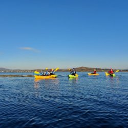 Kayaking with a blue sky in the background