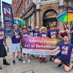 Lovely group of people standing with the Admiral Duncan Memorial Banner