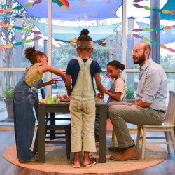 ACGC therapist with young clients in playroom