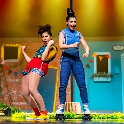 Vana and Huguette pose on stage.