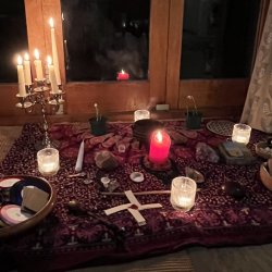 altar with candles and witches tools