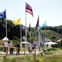 The flags follow the path to the hills