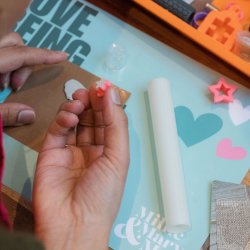 Hands cutting out star from metal clay