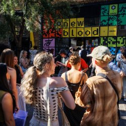 A picture of New Blood Festival entrance with a small crowd