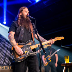 Whitey Morgan playing guitar live