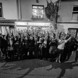 Group of people celebrating outside the warren in carmarthen