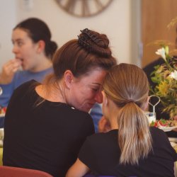Mum and daughter enjoying afternoon tea and connection