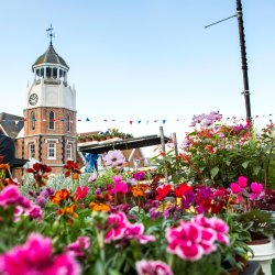 Flower stall, Burnham market - Oct'15 - 3359 SOP - picture of Burnham-on-Crouch clock tower and flowing planters