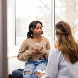 Medical professional talking to patient