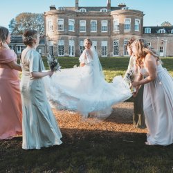 Picture of a Bride and her Bridesmaids in front of  the south side of Upton House