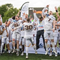 American football players celebrating winning a Bowl game.
