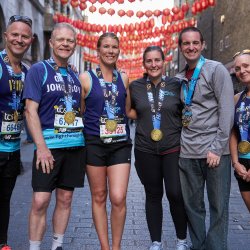 Fight for Sight supporters proudly displaying their medals after completing the London Marathon