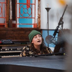 A picture of a rachel grace playing piano