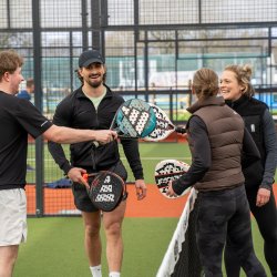 Group of people meeting at the Padel net