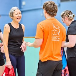 Student learn to play volleyball