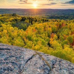 Sunset over a valley full of fall color