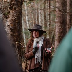 Sarah Hobbs telling a story in the woods