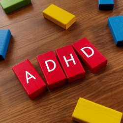 ADHD spelled out in red building blocks