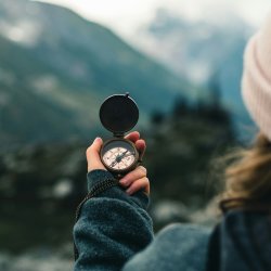 Photo by <a href="https://unsplash.com/@lureofadventure?utm_source=unsplash&utm_medium=referral&utm_content=creditCopyText">Ali Kazal</a> on <a href="https://unsplash.com/photos/person-holding-compass