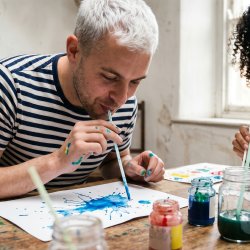 Man blowing paint