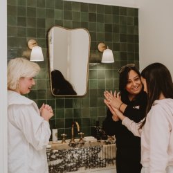 Mum and daughter learning hand massage
