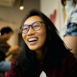 https://unsplash.com/photos/man-in-brown-and-white-coat-sitting-on-brown-wooden-floor-NYt93hX1JP4