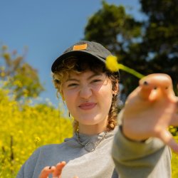 https://unsplash.com/photos/portrait-of-a-nonbinary-autistic-person-outdoors-4DaoOT33dHc
