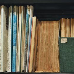 Books and serials on a shelf