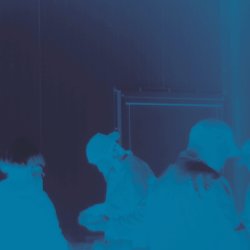 Film still. Rehana Zaman, 2025. people dancing in a blue toned photo