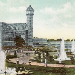 a colour postcard of the Crystal Palace showing the building, garden and fountains