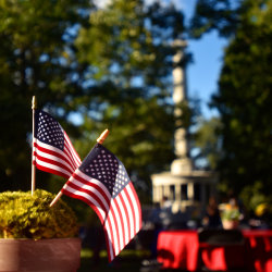 Flags decorate guest tables with the Peace Monument in the background.